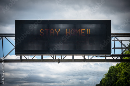 A digital highway sign pleads with drivers to 