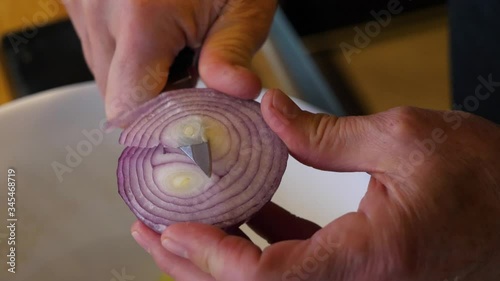 Cutting an Onion - Making a Salad in an Italian Kitchen 60fps Slow Motion photo