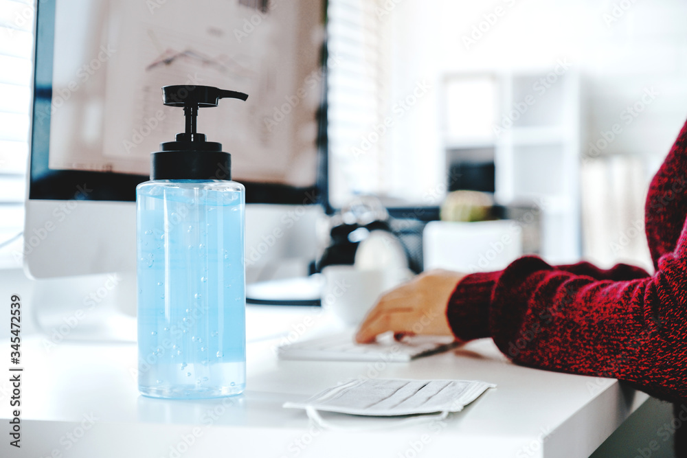 Woman hands using alcohol gel clean wash hand sanitizer anti virus bacteria and working from home