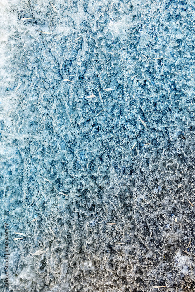 Ice and snow melt in the spring. Abstract natural texture as background