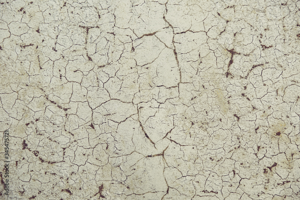 cracks on old paint on rusty metal. beautiful backdrop with cracks on the wall cracks on old paint on rusty metal. beautiful backdrop with cracks on the wall