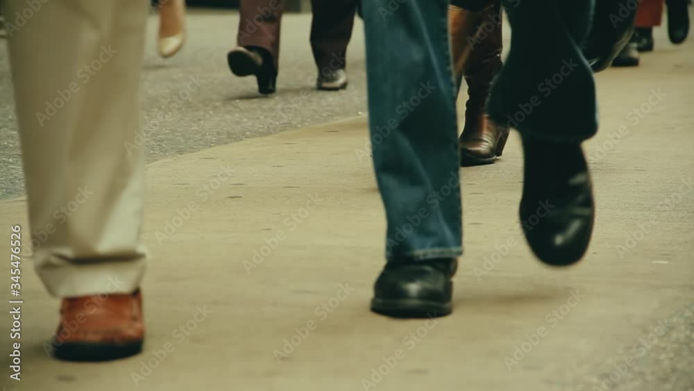 Low angle of people legs walking in crowded street of New York. Lockdown Low angle of people legs walking in crowded street of New York. Lockdown