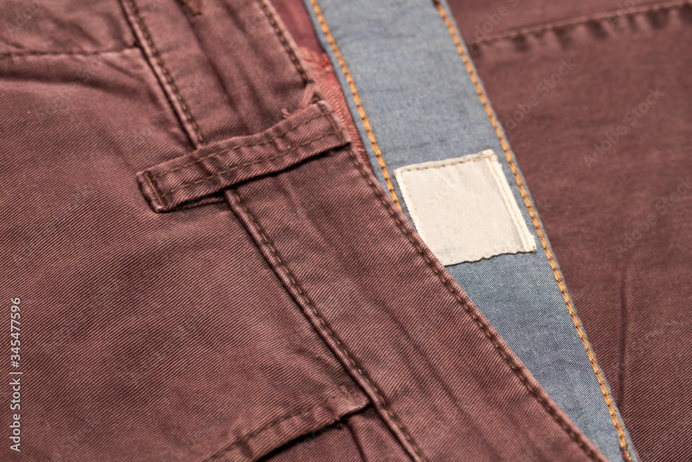 Dark cherry Denim Texture. Denim background of jeans of unusual color