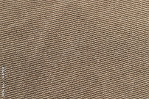 Dark olive denim texture. Denim background of jeans of unusual color