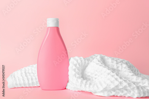 Fototapeta Naklejka Na Ścianę i Meble -  Shower gel and towel on color background