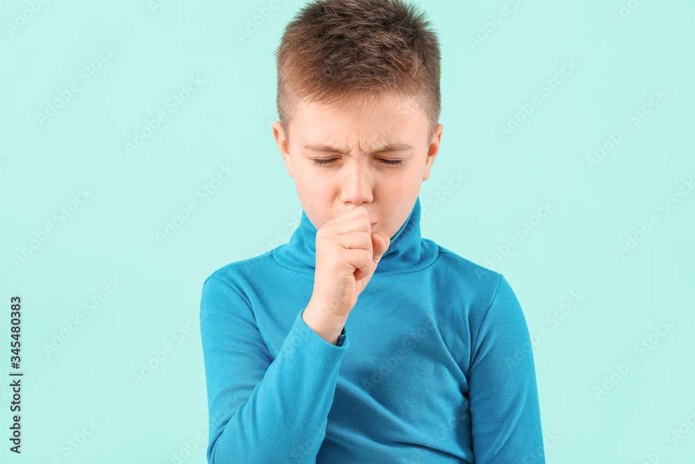 Ill coughing little boy on color background Ill coughing little boy on color background