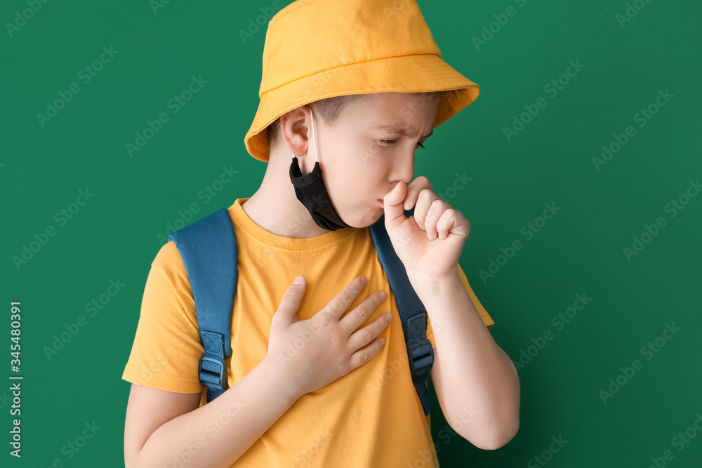 Ill coughing little boy on color background Ill coughing little boy on color background