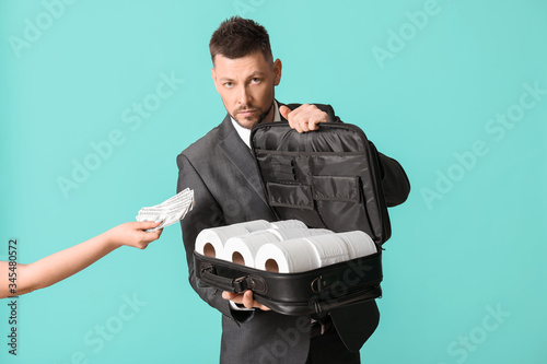 Woman paying for toilet pap...