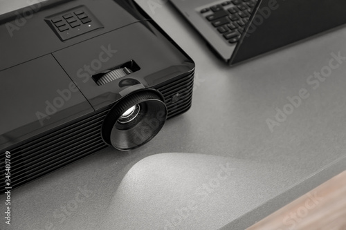 Video projector on table in...