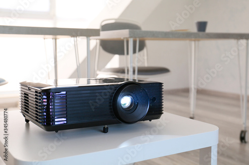 Video projector on table in...