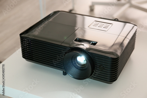 Video projector on table in...