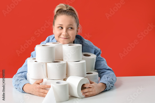 Woman with heap of toilet p...