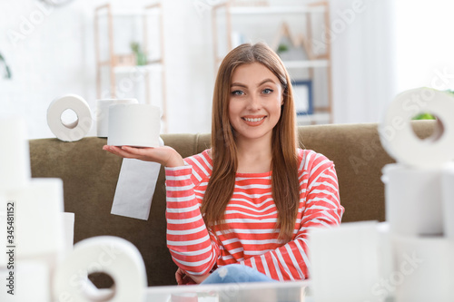 Woman with heap of toilet p...