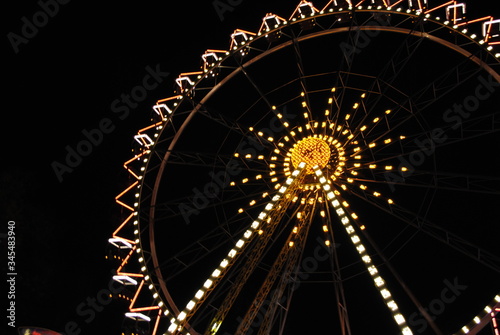 Ferris wheel at night on the amusement park