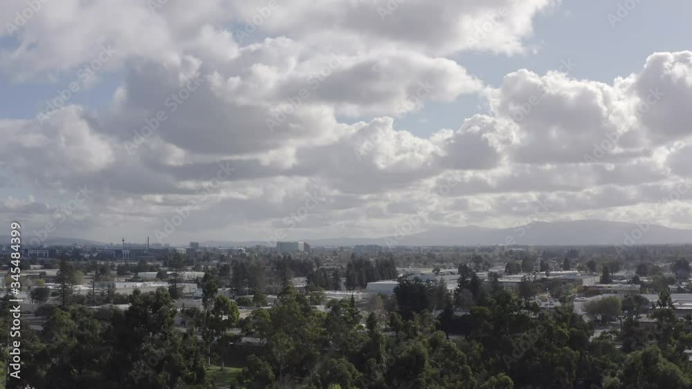 Aerial flight towards heavily populated city, highway and mountains, Sunnyvale, California Aerial flight towards heavily populated city, highway and mountains, Sunnyvale, California