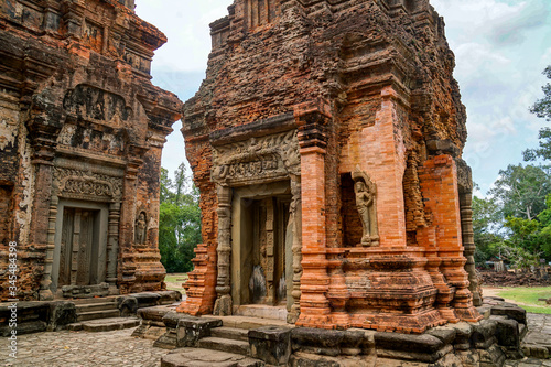 Preah Ko  Angkor Wat temple in Cambodia  dilapidated red brick structure  beautiful carved building