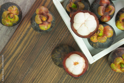Mangosteen, the queen of fruits, is sweet. on the table close up