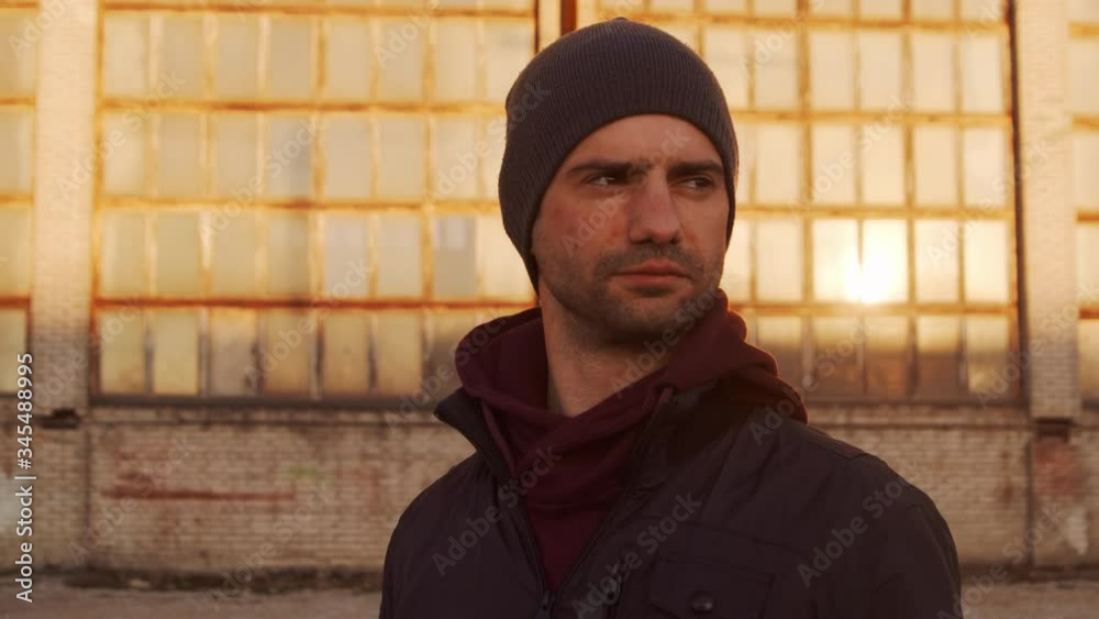 Portrait of a man over industrial buildings and sunset background. Portrait of a man over industrial buildings and sunset background.