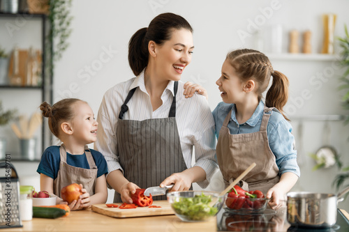 Happy family in the kitchen. © Konstantin Yuganov
