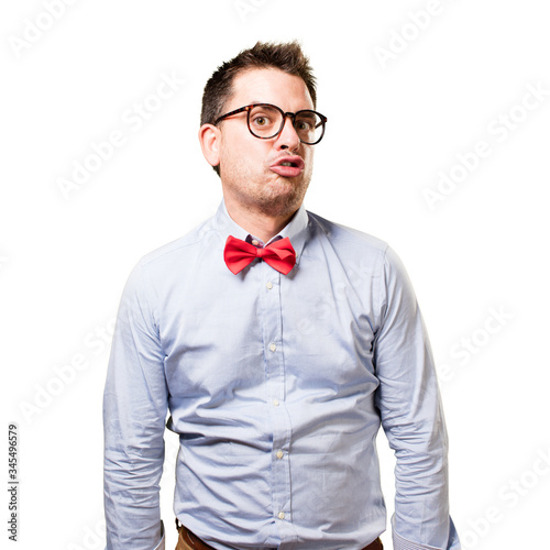 Man wearing a red bow tie. Looking funny. © borjandreu