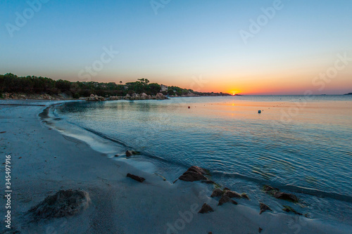 Wallpaper Mural A landscape with the beautiful colors of sunrise on a summer vacation day with the deserted beach without people, in Sardinia Italy Torontodigital.ca