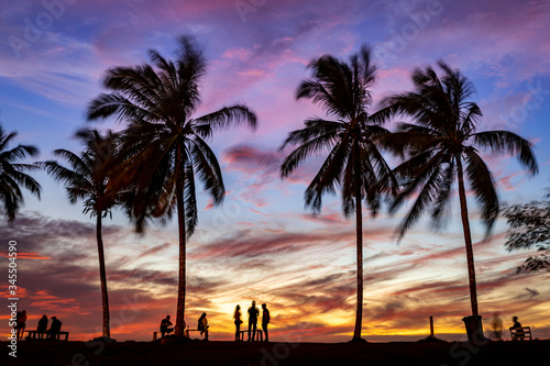 Fototapeta Naklejka Na Ścianę i Meble -  sunset with palm trees at the beach