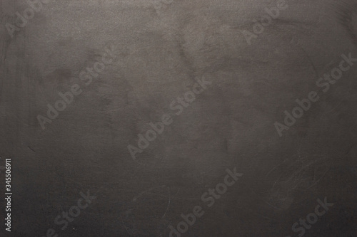 Black chalk board. Can be used as texture or wallpaper. Flat lay, top view