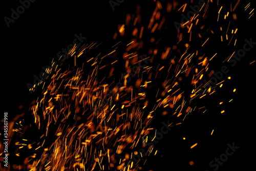 flame of fire with sparks on a black background