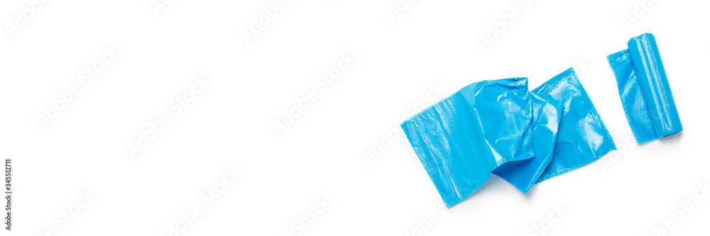 Blue trash bag on an isolated white background. The concept of cleaning, garbage removal. Flat lay, top view