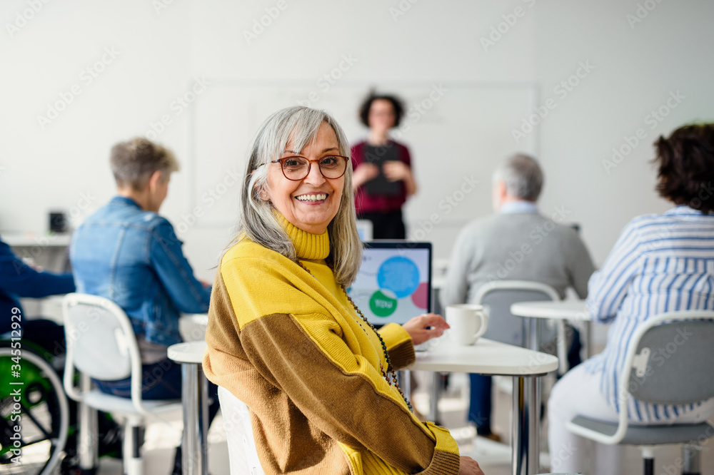 Portrait of senior attending computer and technology education class. Portrait of senior attending computer and technology education class.