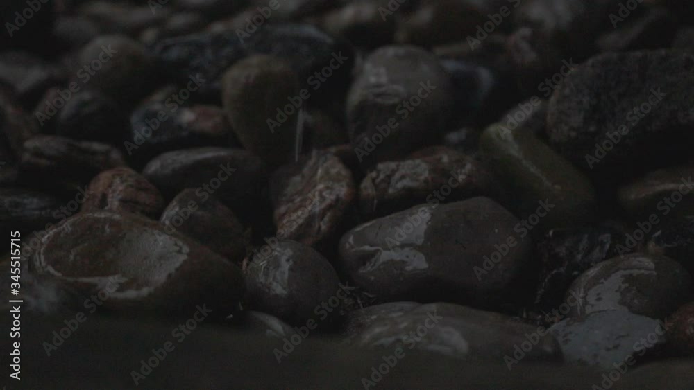 Close Up Of A Small Stone With Rain Drops - Close Up Shot Close Up Of A Small Stone With Rain Drops - Close Up Shot