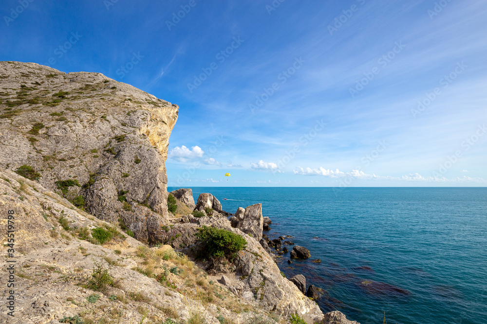 Beautiful summer sea landscape at the resort in the Crimea. Rocky coast of the black sea. Seascape.