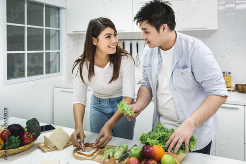 Young couple cooking together