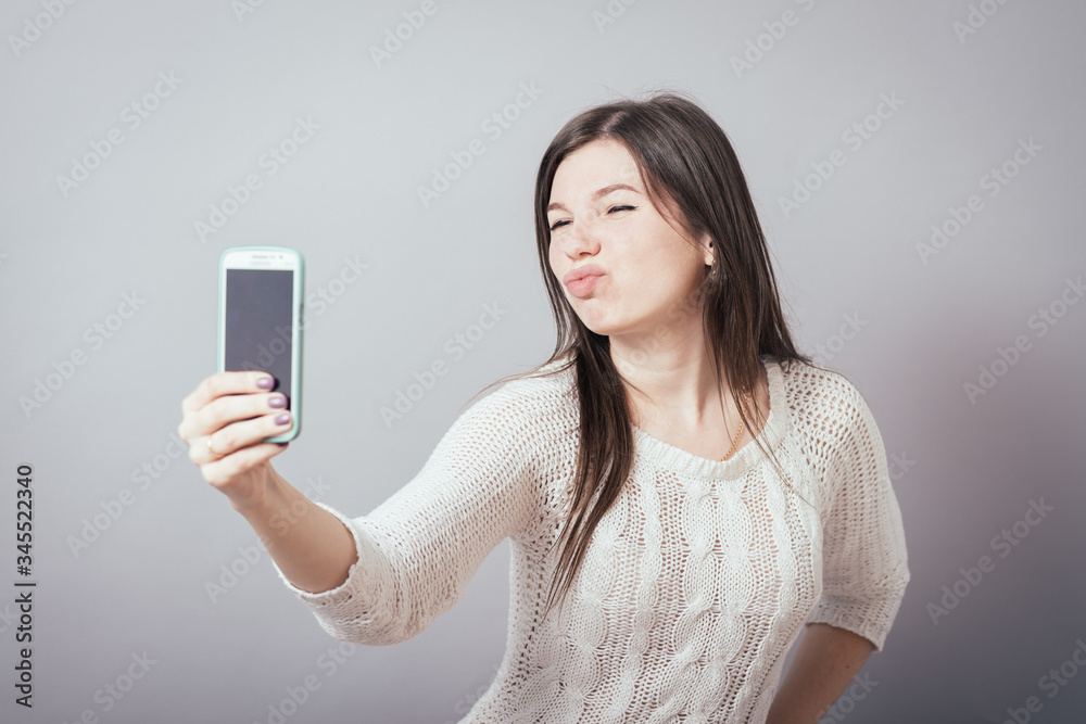 girl photographed themselves on a mobile phone girl photographed themselves on a mobile phone