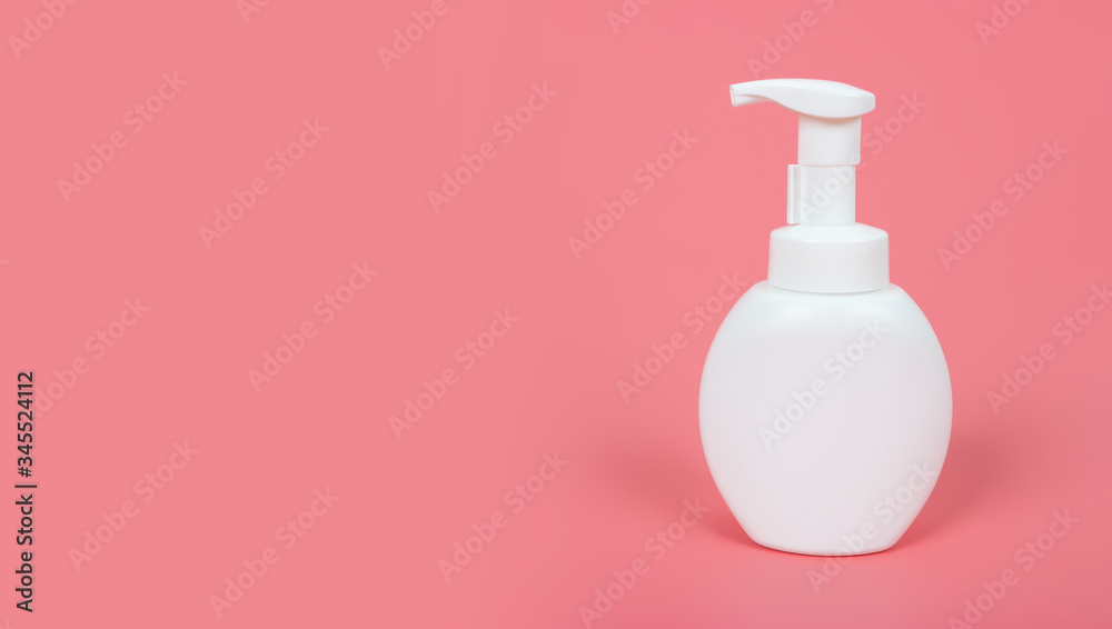 Cosmetic mock up bottle on pastel pink background Cosmetic mock up bottle on pastel pink background