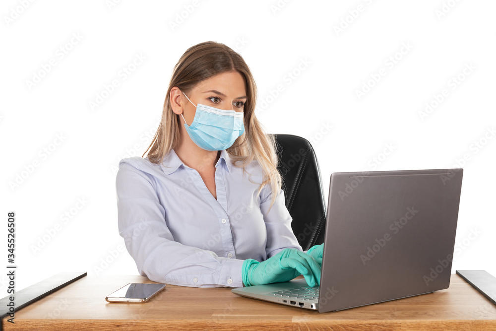 Business woman with mask at work - isolated Business woman with mask at work - isolated