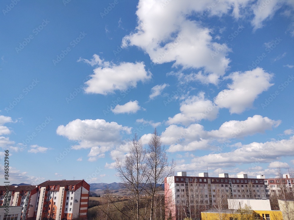Sunrise and sunset, beautiful clouds over the meadow, hills and buildings in the town. Slovakia Sunrise and sunset, beautiful clouds over the meadow, hills and buildings in the town. Slovakia