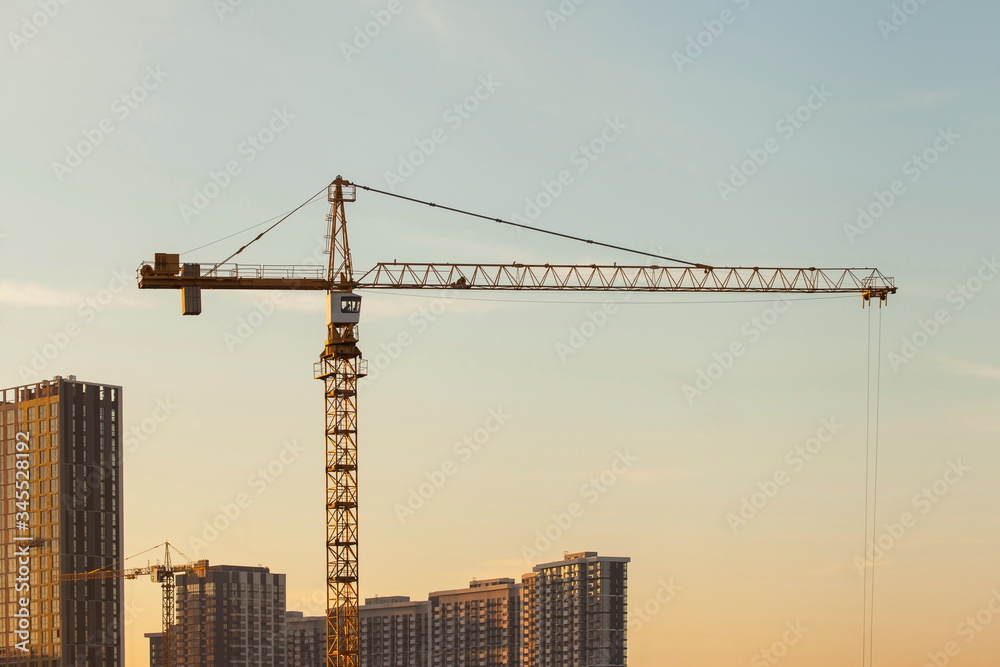 construction site with crane against the blue sky	