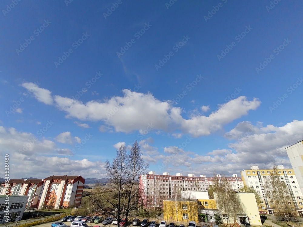 Sunrise and sunset, beautiful clouds over the meadow, hills and buildings in the town. Slovakia Sunrise and sunset, beautiful clouds over the meadow, hills and buildings in the town. Slovakia