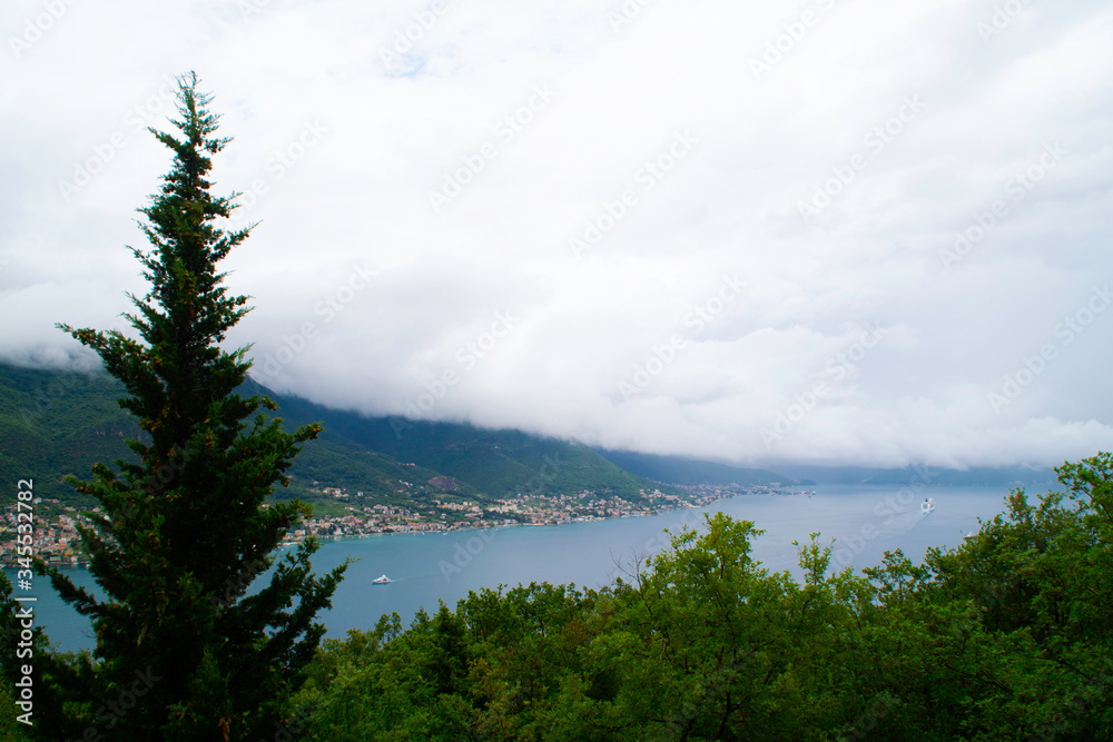 A storm on the coast. White cloud from mountains covering the Bay of Kotor to the point of invisibility.