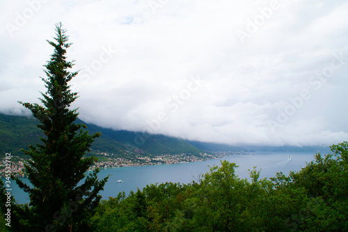 A storm on the coast. White cloud from mountains covering the Bay of Kotor to the point of invisibility.