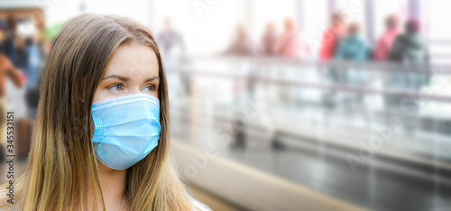 Woman in face mask copy space for text. Coronavirus flu epidemic travel of the city concept wide banner panorama