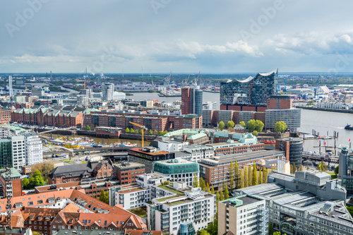 Aerial view of downtown of  Hamburg with harbor and modern buildings of Hamburg, Germany, view from the clock tower of Church of St. Michael. © zz3701