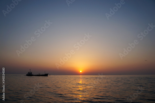 beautiful sunrise and ship on sea  © rokacaptain