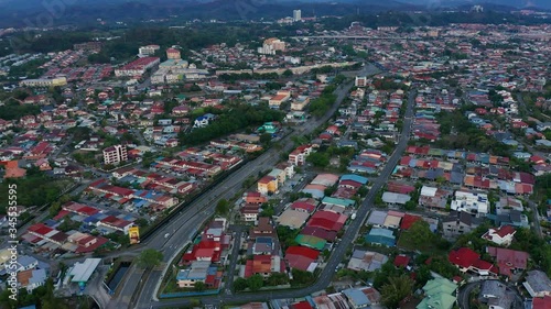 Aerial Footage of Silence city and few cars pass through quite Streets in Luyang Kota Kinabalu, Sabah, Malaysia during lockdown because of Coronavirus pandemic. Empty roads, no traffic. 4k photo