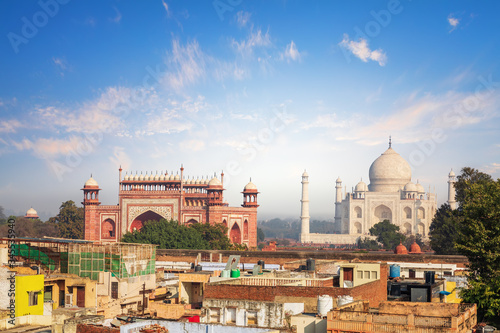 Agra view: poor houses and Taj Mahal, India