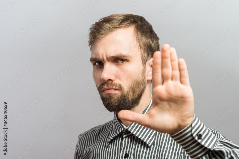 Fototapeta premium young strictly man making stop with his hand