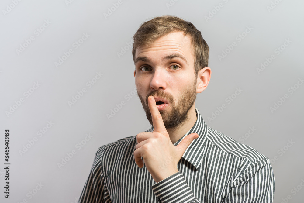 Man making silence gesture Man making silence gesture
