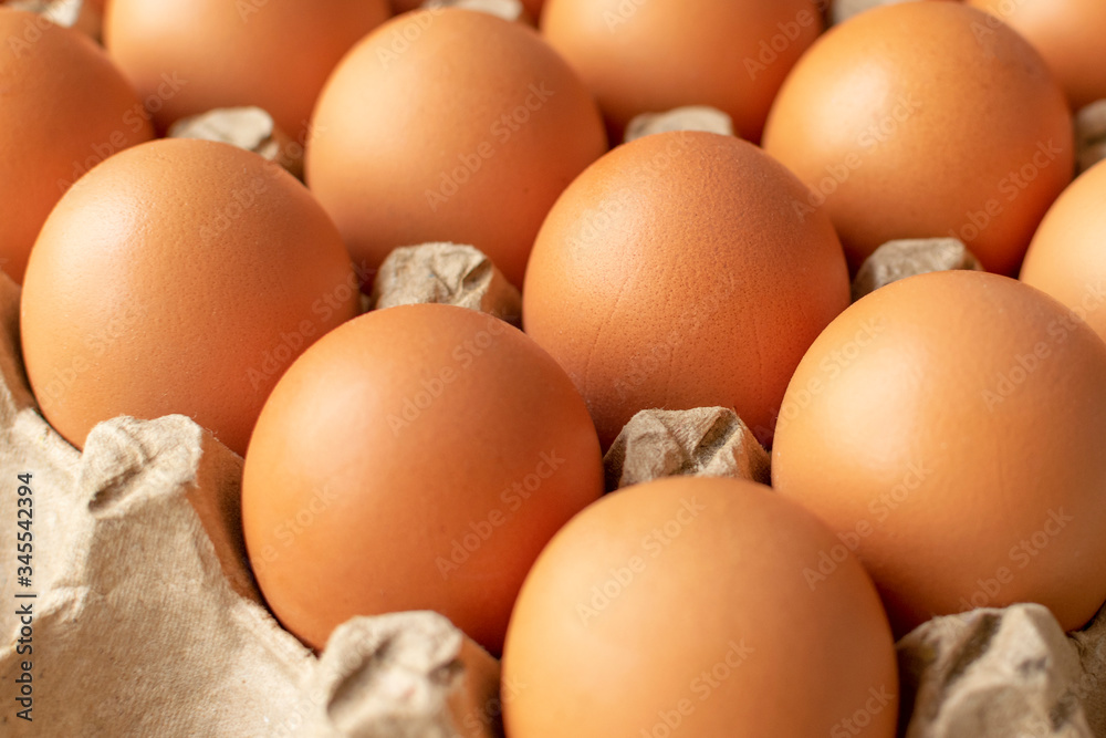Brown egg in paper packaging. Container for eggs. Recycling. Healthy rustic breakfast Brown egg in paper packaging. Container for eggs. Recycling. Healthy rustic breakfast