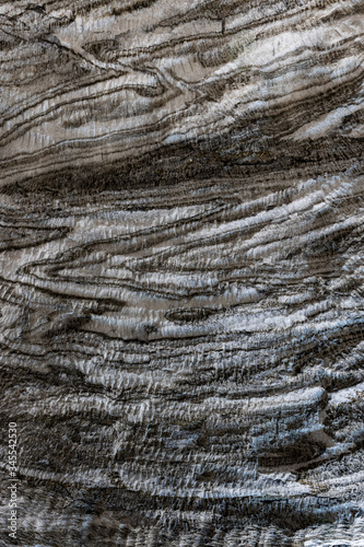 Abstract gray texture of natural, raw salt in an underground salt mine